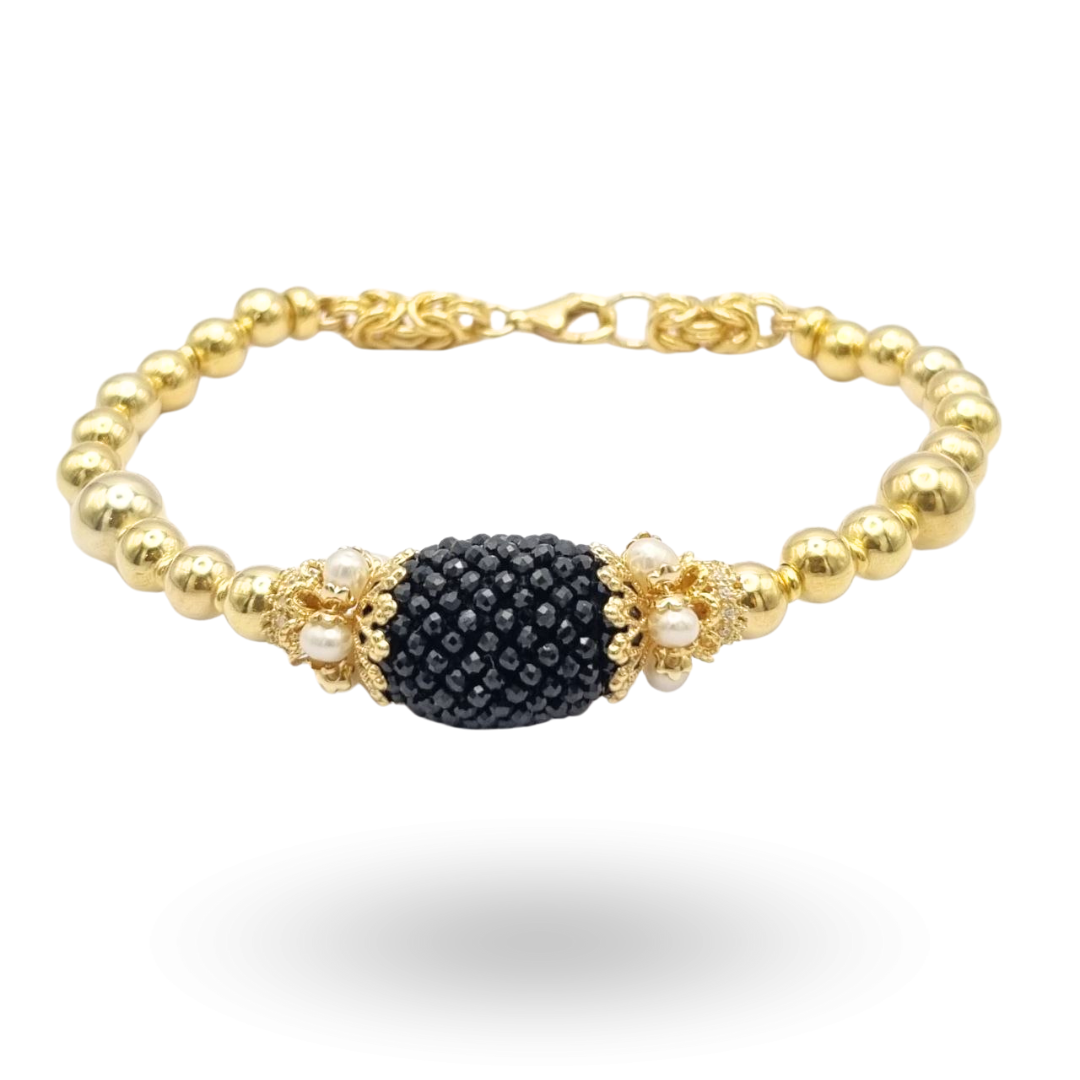 Bracciale semirigido linea Barocca con sfere in Argento 925 dorato e oliva centrale in Spinelli neri lavorazione tessito con coroncine in Perle