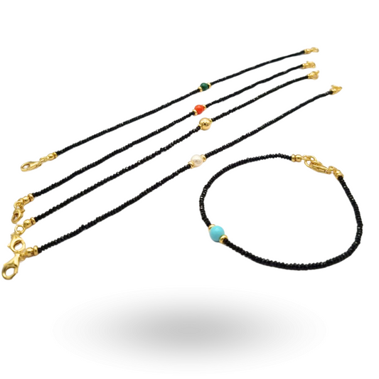 Bracciale in Spinelli neri sfaccettati con pallino centrale a scelta con Pasta di Turchese, Perla, Corallo, Gold o Malachite